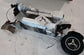Real unboxing photo of Glidezone GD83 adult electric scooter showing packaged accessories and folded frame.