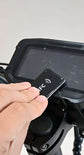 Close-up of a user unlocking the Glidezone GD83 electric scooter with an NFC card swipe ignition.