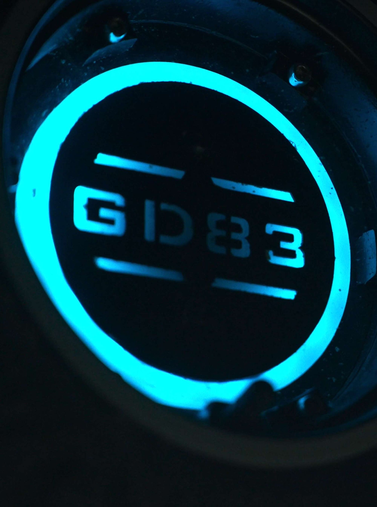 Close-up of the custom ambient LED light glowing near the quick-release wheel hub of Glidezone GD83.