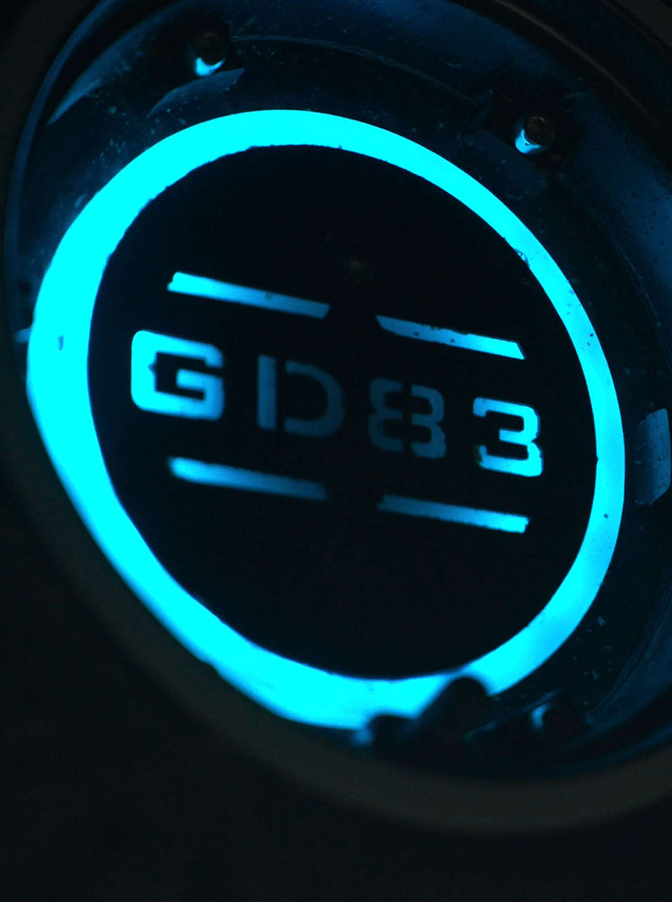 Close-up of the custom ambient LED light glowing near the quick-release wheel hub of Glidezone GD83.