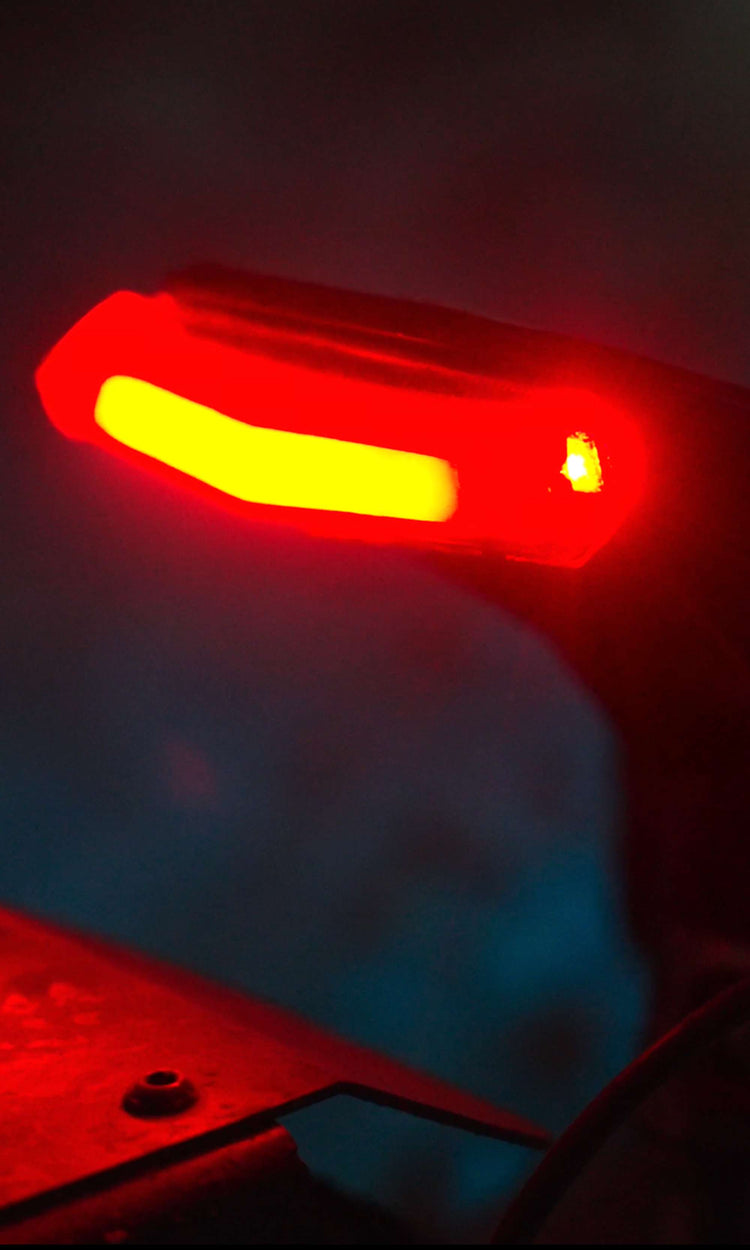Close-up of the rear tail brake lights and flashing yellow turn signals on Glidezone GD83.