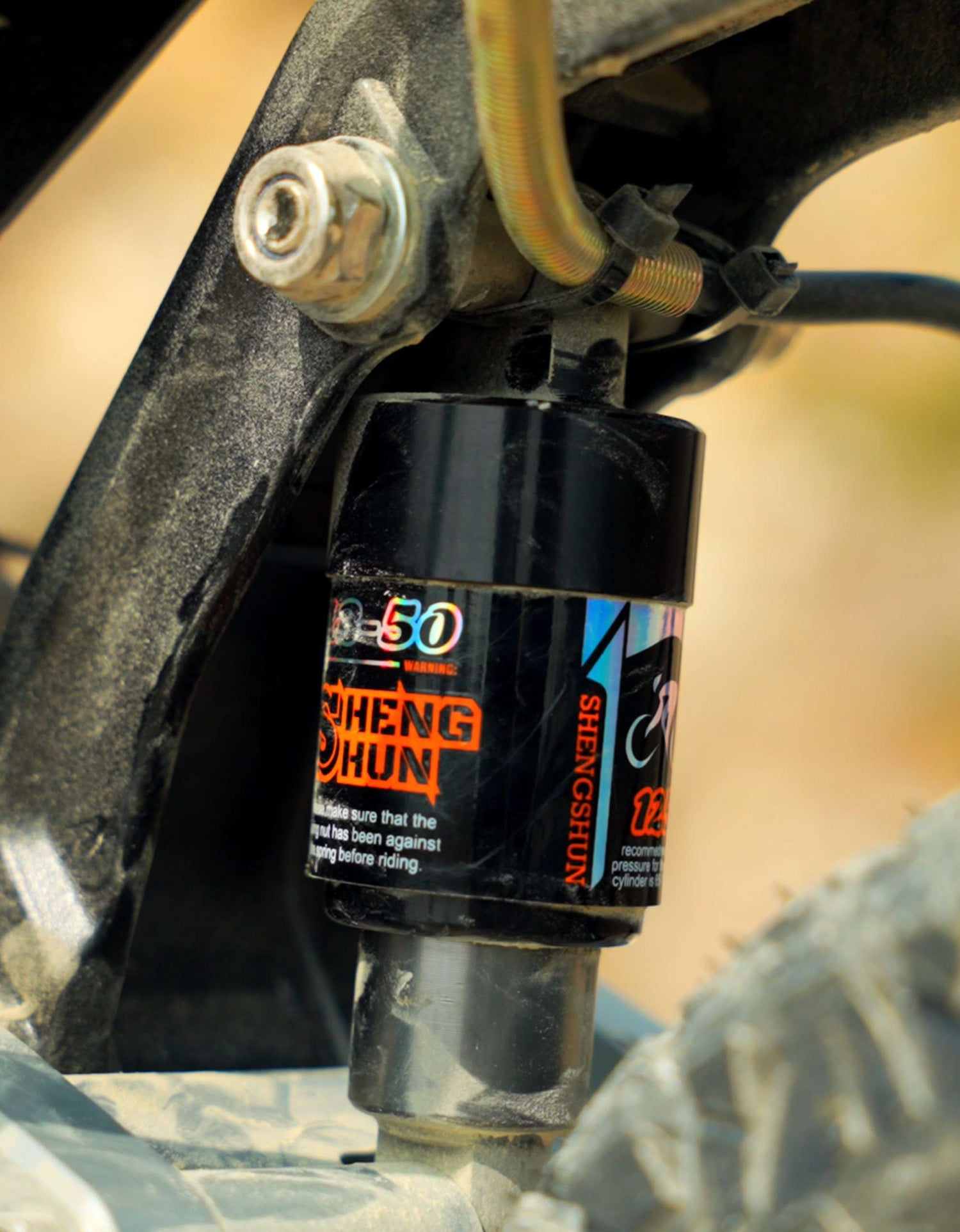 Close-up view of the premium rear hydraulic suspension shock absorption system on Glidezone GD83.
