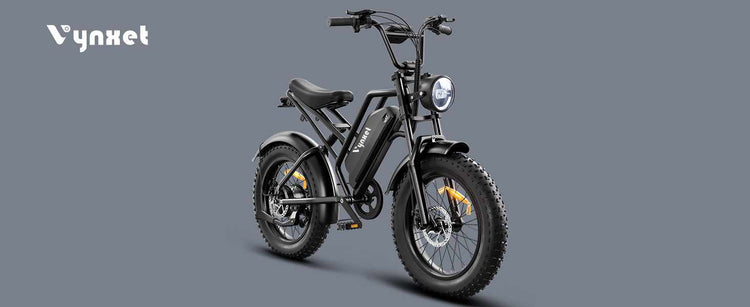 Full profile shot of the HappyRun Vynxet G50 fat tire electric bike from a right 45 degree angle showing the frame front light and fat tires.