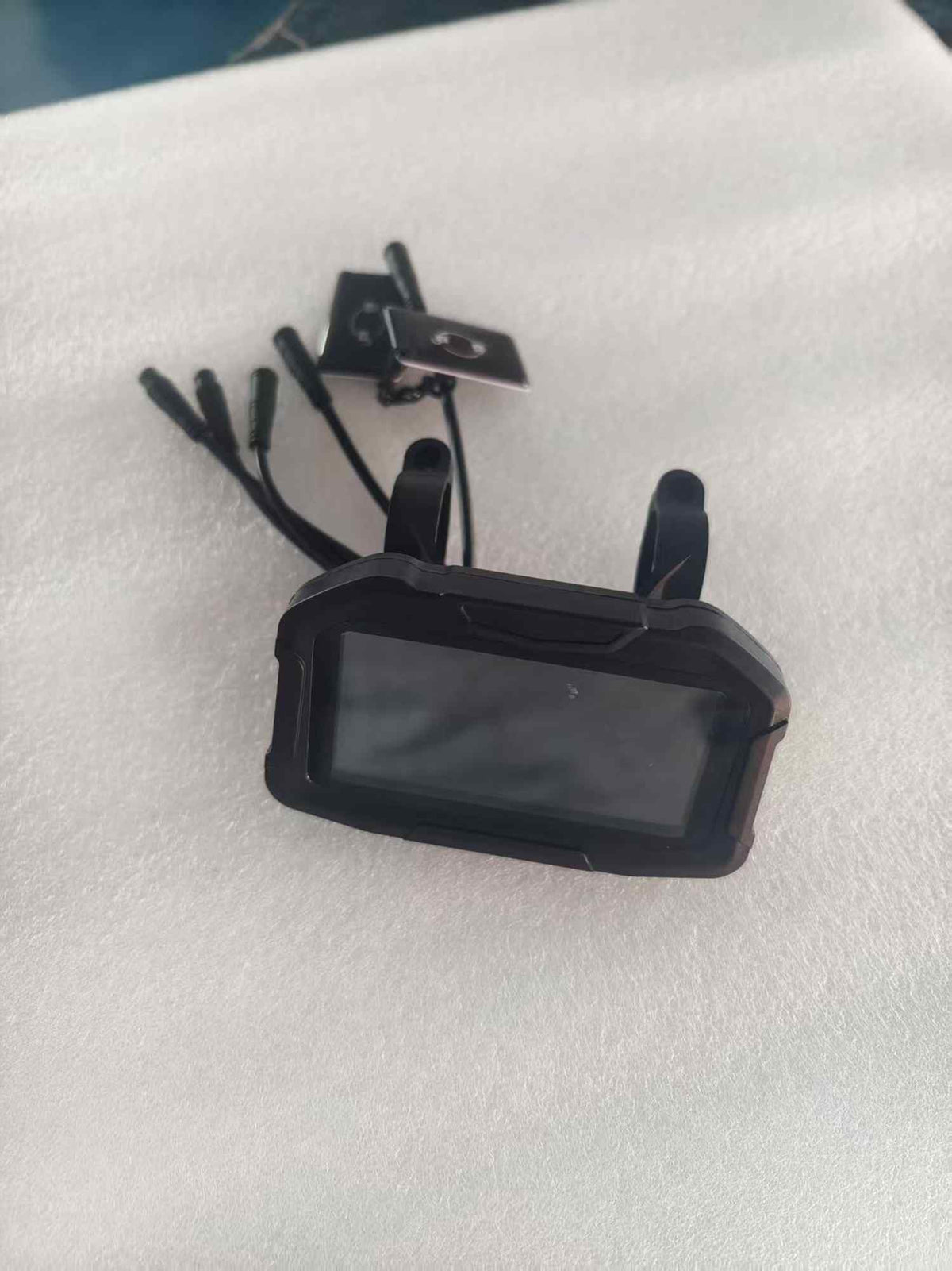 A black digital LCD display screen with handlebars mounts for the RONZLLA RZ2 Fast Electric Scooter, shown with its connected cables and two black NFC key cards.