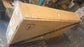 A large Mangosteen branded cardboard shipping box wrapped in clear plastic inside a US warehouse, showcasing wholesale used electric scooter or e-bike inventory ready for freight delivery.